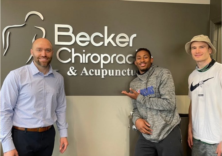 Dr. Dane Becker with NBA player Craig Sword and an Omaha's Finest teammate