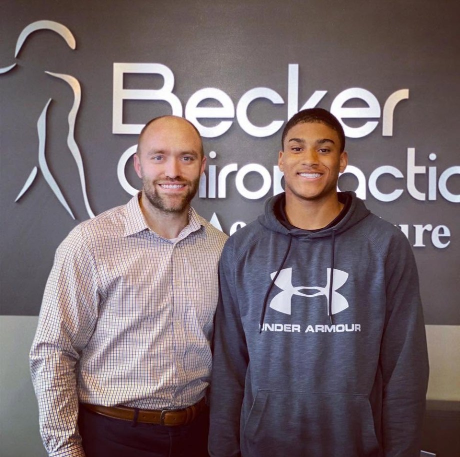 Xavier Watts with Dr. Dane Becker at Becker Chiropractic in West Omaha